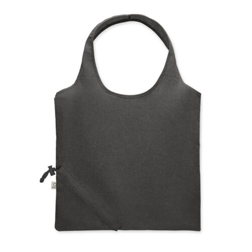Bolsa plegable ecológica CARRIE fabricada en algodón reciclado y RPET, con diseño compacto y sistema de almacenamiento en su propio bolsillo