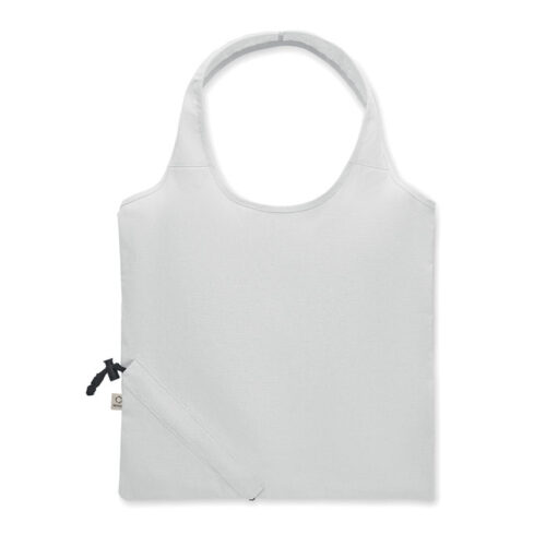 Bolsa plegable ecológica CARRIE fabricada en algodón reciclado y RPET, con diseño compacto y sistema de almacenamiento en su propio bolsillo