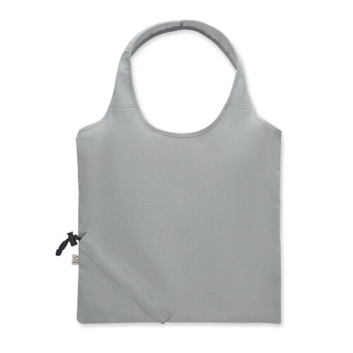 Bolsa plegable ecológica CARRIE fabricada en algodón reciclado y RPET, con diseño compacto y sistema de almacenamiento en su propio bolsillo