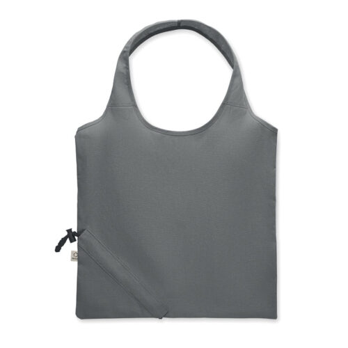 Bolsa plegable ecológica CARRIE fabricada en algodón reciclado y RPET, con diseño compacto y sistema de almacenamiento en su propio bolsillo