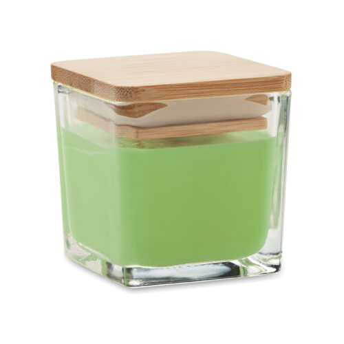 Vela aromatizada de manzana en frasco de cristal con tapa de bambú, ideal como regalo promocional sostenible
