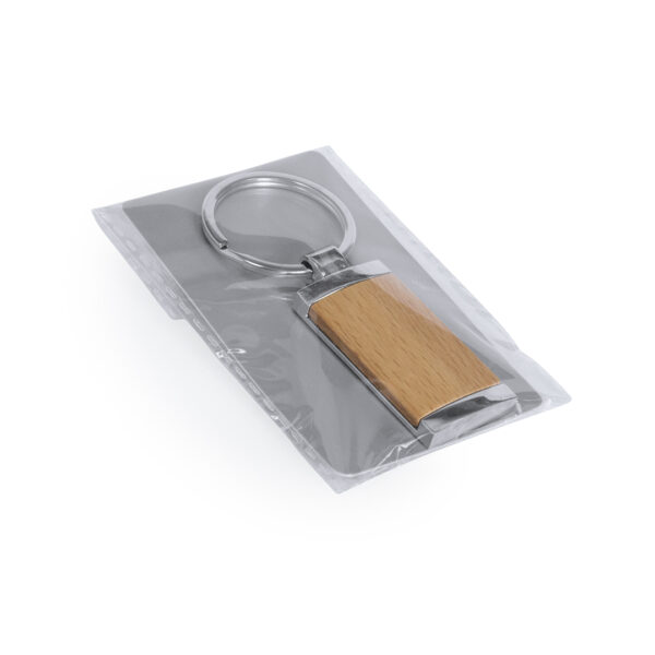 Llavero redondo de madera y metal brillante con diseño elegante, ideal para personalización con logotipo grabado