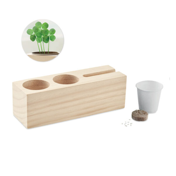 Soporte de madera THILA con ranura para móvil y semillas de trébol