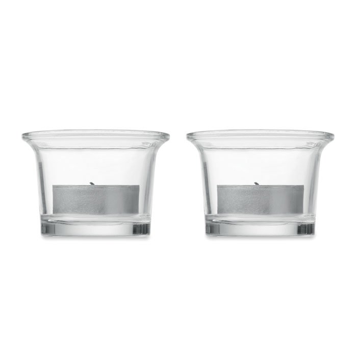 Los dos vasos de vidrio con sus velas